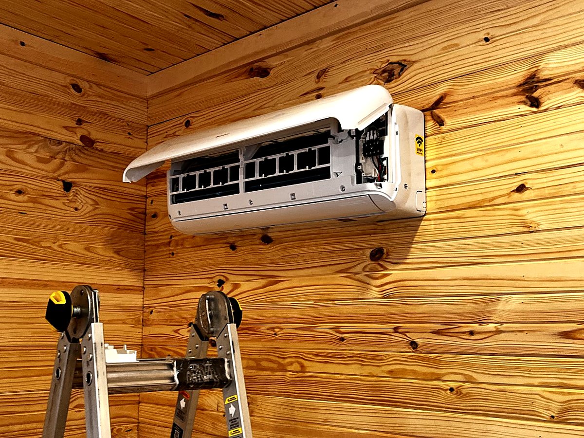 Ductless mini-split indoor head installed on a cabin wall